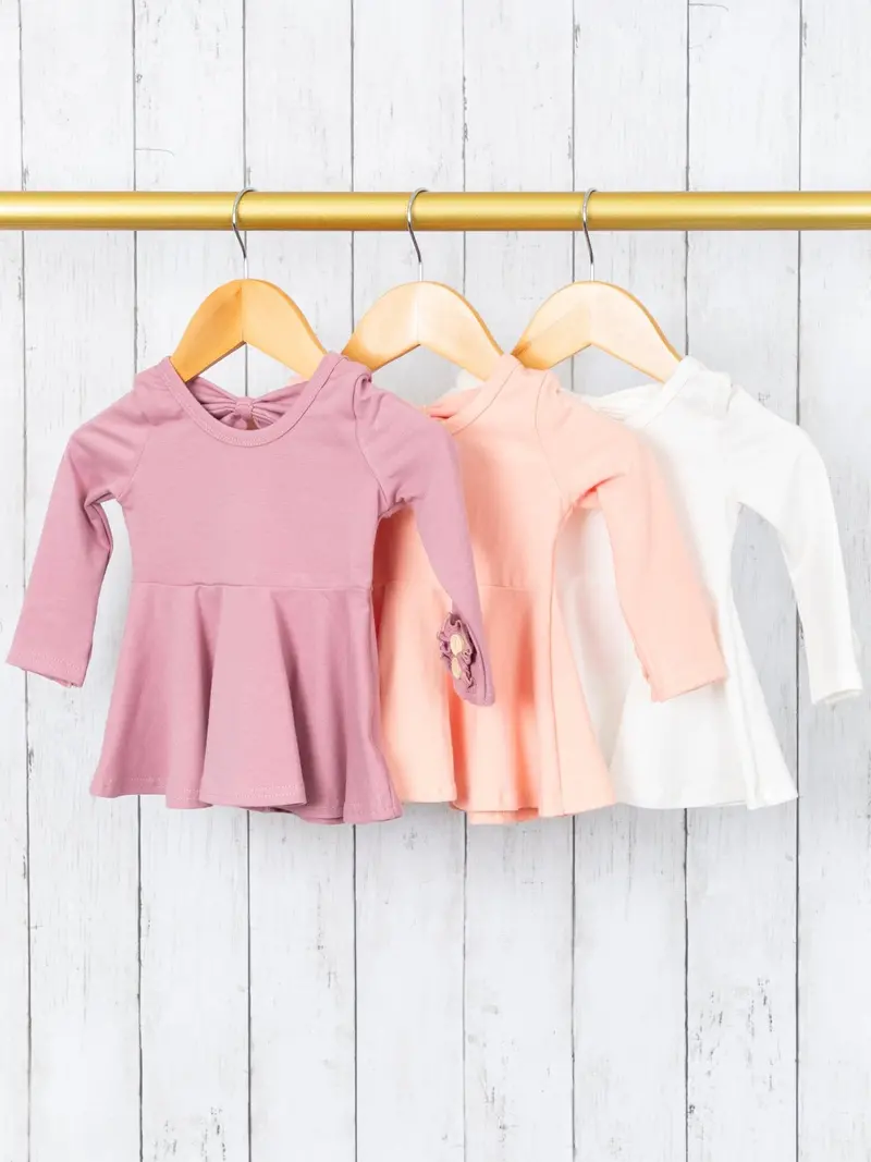 Light-Hue Peplum Top With Bow Back, Button Detail, And Ruffle Sleeves 1