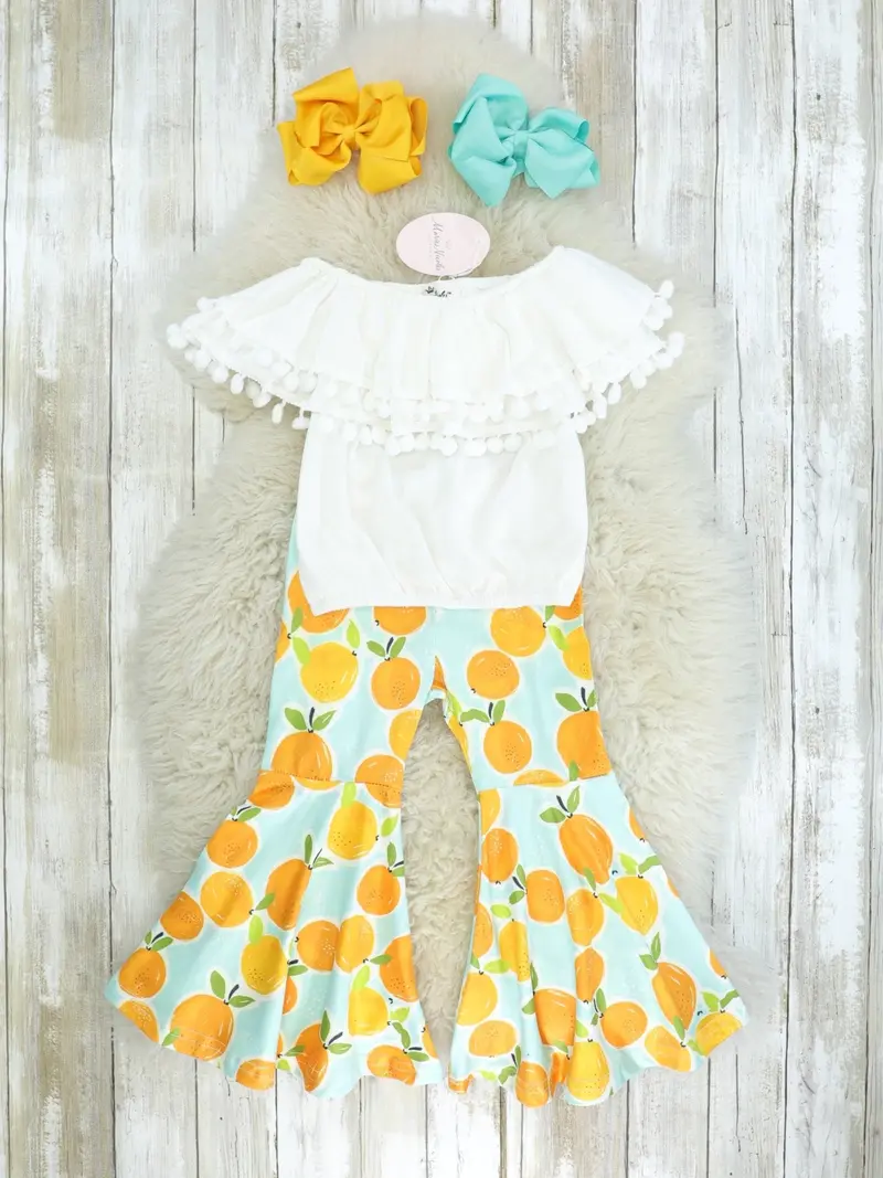 White Pom-Pom Top With Citrus-Print Bell-Bottom Pants 1