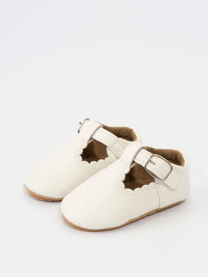 White T-Strap Shoes With Scalloped Edges And Buckle Accent 1